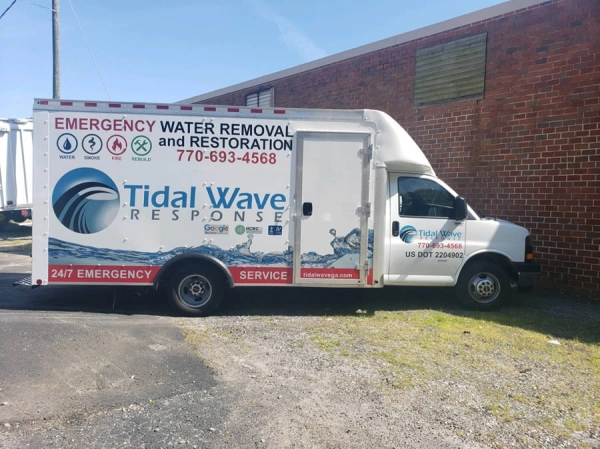 Tidal Wave Response emergency service truck parked.