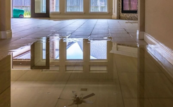 Flooded room with reflections on the floor.