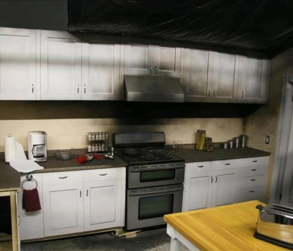 Kitchen with smoke damage above the stove.