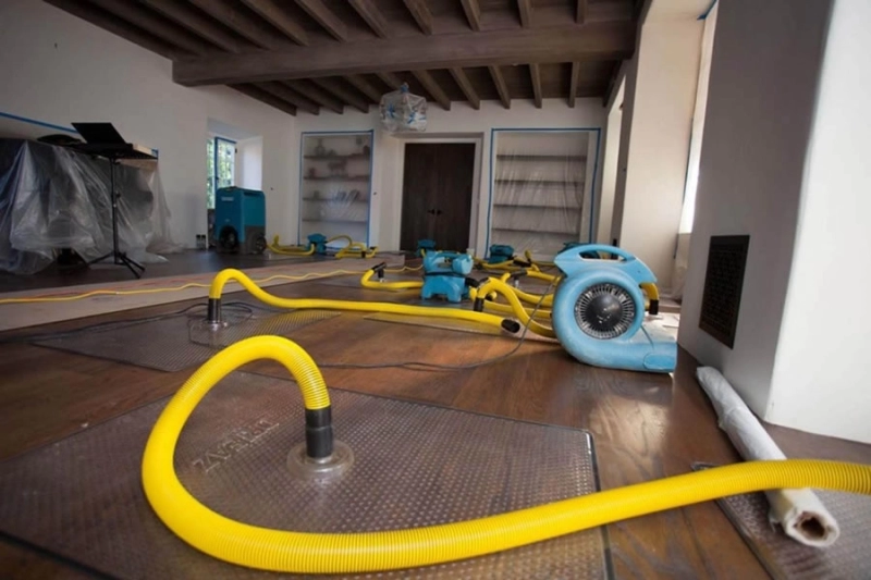 Water damage restoration equipment in a room.