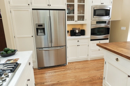 Modern kitchen with stainless steel appliances.