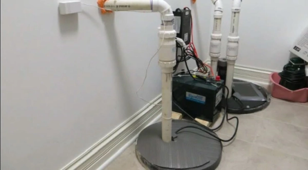 Sump pump system with connected pipes.